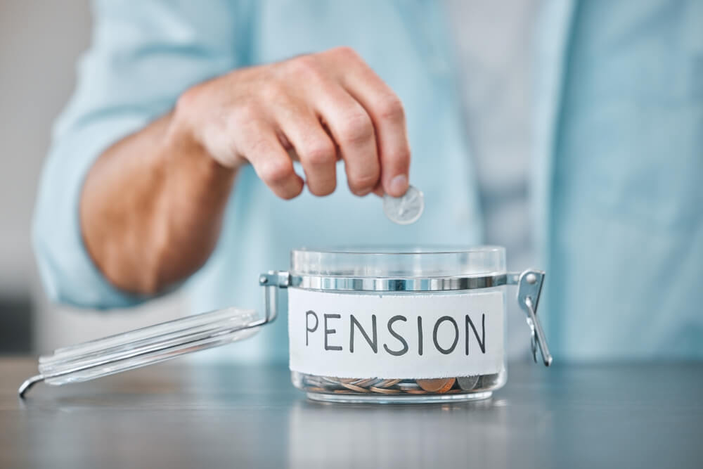 Director reviewing employer pension contributions and company financial records, highlighting how allowable business expenses reduce taxable profits and Corporation Tax.